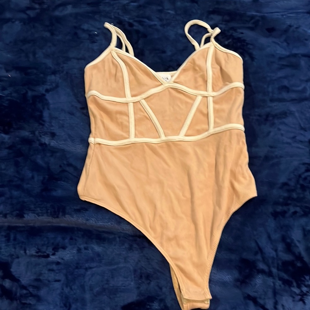 beige and white bodysuit